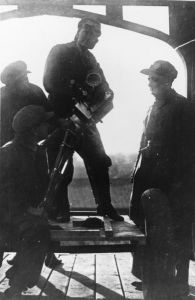 Vertov and colleagues in a backlit shot during the filming of "Ėntuziazm"