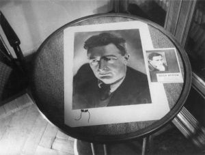 Photograph and leaflet on a table-top, 1960 at the earliest