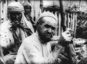 Mann mit Stock in dern Hand